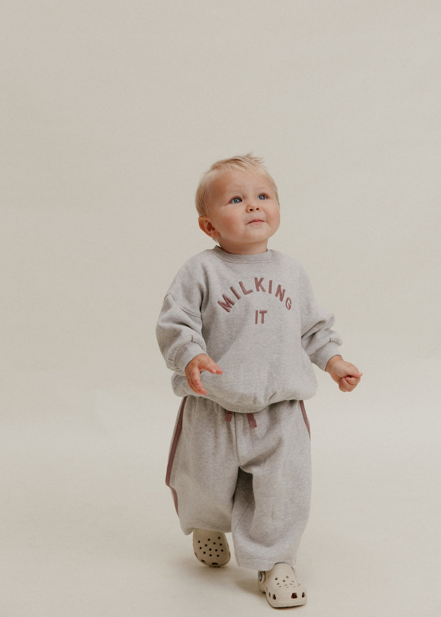 carner milking it grey sweater