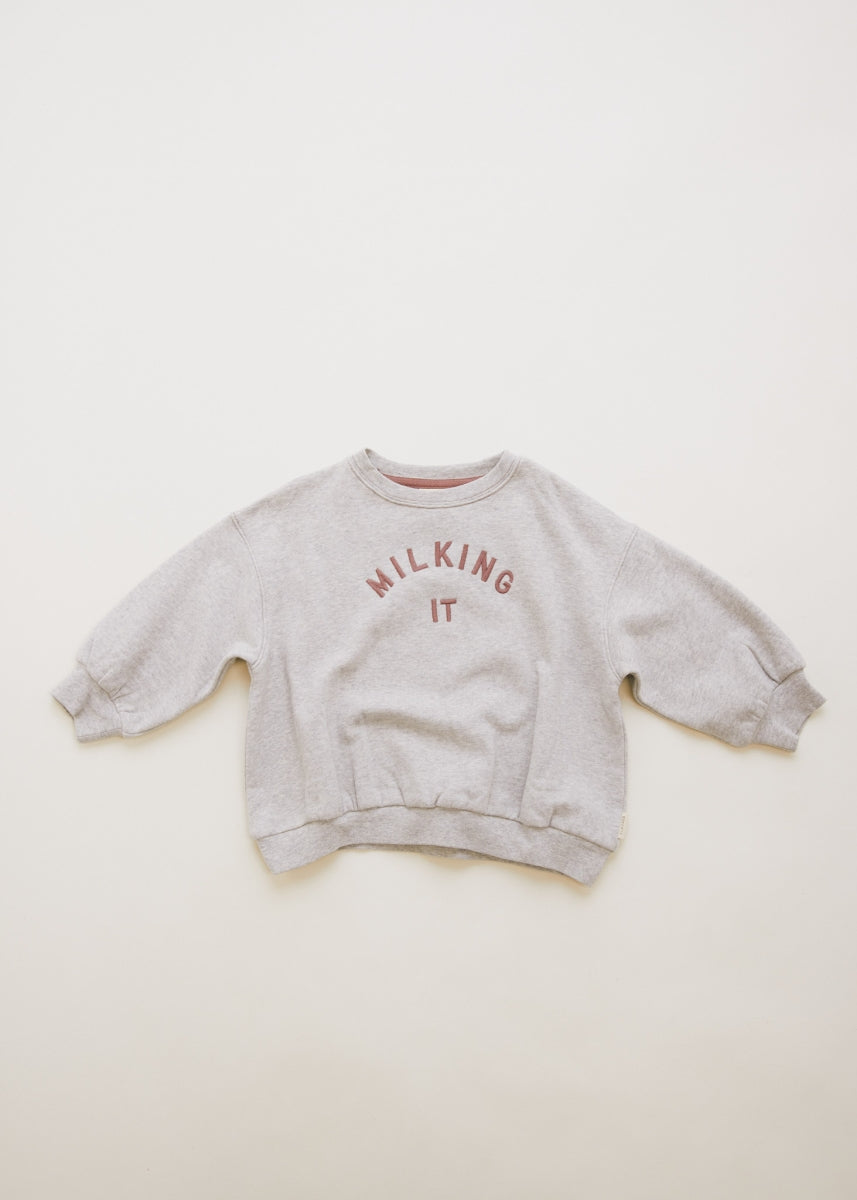 carner milking it grey sweater